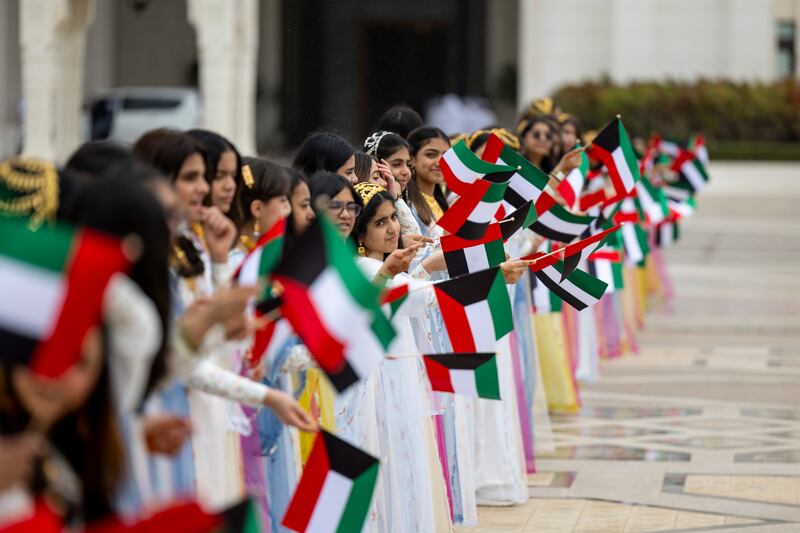 Schoolchildren wait to welcome Sheikh Meshal at Qasr Al Watan. Ryan Carter / UAE Presidential Court