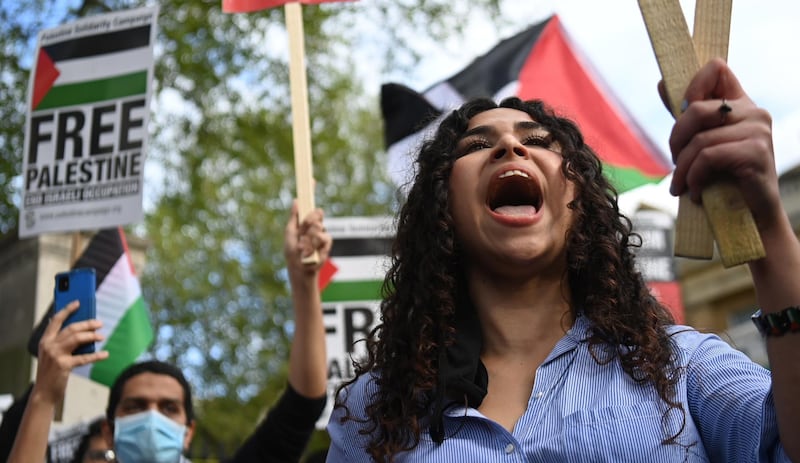 Supporters of Palestine attend a rally at Downing street. EPA