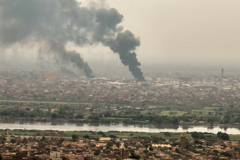 Black smoke rises over Khartoum on April 28. AFP