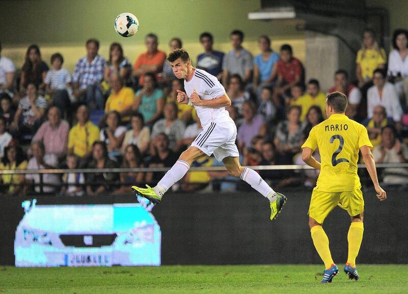 VILLARREAL, SPAIN - SEPTEMBER 14:  Gareth Bale (L) of Real Madrid in action against Mario Gaspar of Villarreal  during the La Liga match between Villarreal and Real Madrid at El Madrigal on September 14, 2013 in Villarreal, Spain.  (Photo by Denis Doyle/Getty Images)