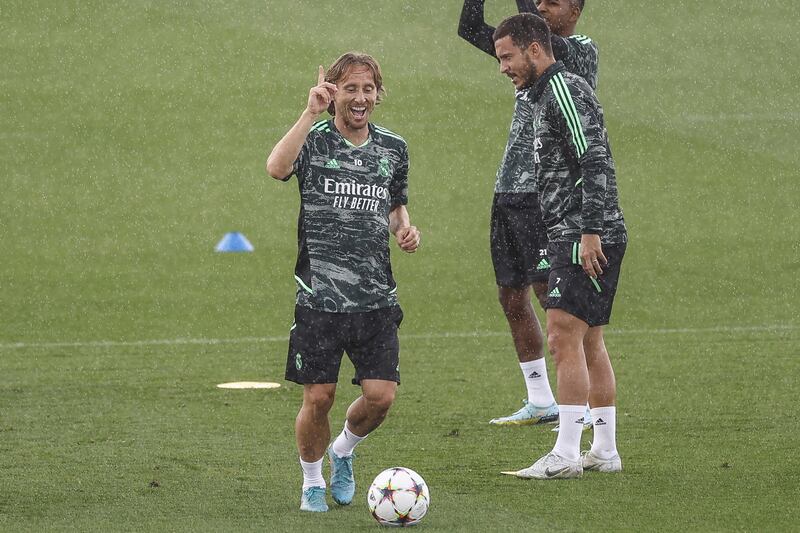 Real midfielder Luka Modric celebrates during training. EPA
