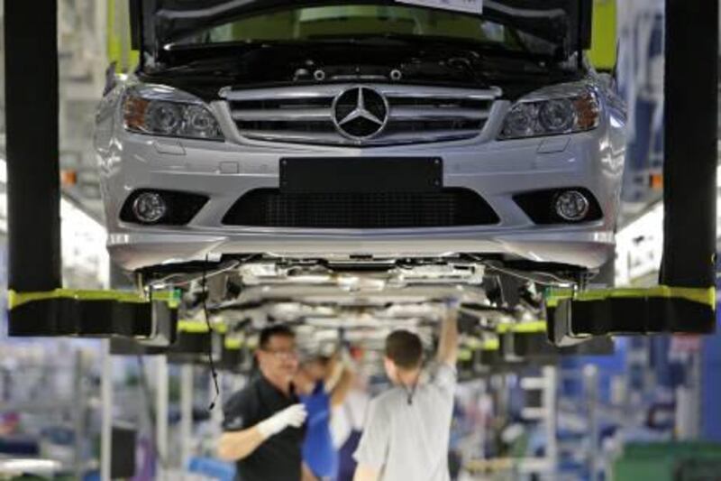 FILE -  In this Jan. 25, 2008 file photo employees of German car producer Daimler work on Mercedes C-class sedans on the production line in the plant in Sindelfingen near Stuttgart, Germany. Daimler CEO and head of Mercedes-Benz Cars, Dieter Zetsche announced to shareholders Wednesday, April 13, 2011 that the car maker is sticking with its profit expectation for this year, despite the disaster in Japan and uncertainty from turmoil in the Arab world. Zetsche says the company will make "significantly higher" profit this year than last. In 2010 the Stuttgart-based automaker made 7.2 billion euros (US $10.3 billion) in operating earnings. (AP Photo/Thomas Kienzle, File) *** Local Caption ***  SMM102_DEU_Daimler_Profits.jpg