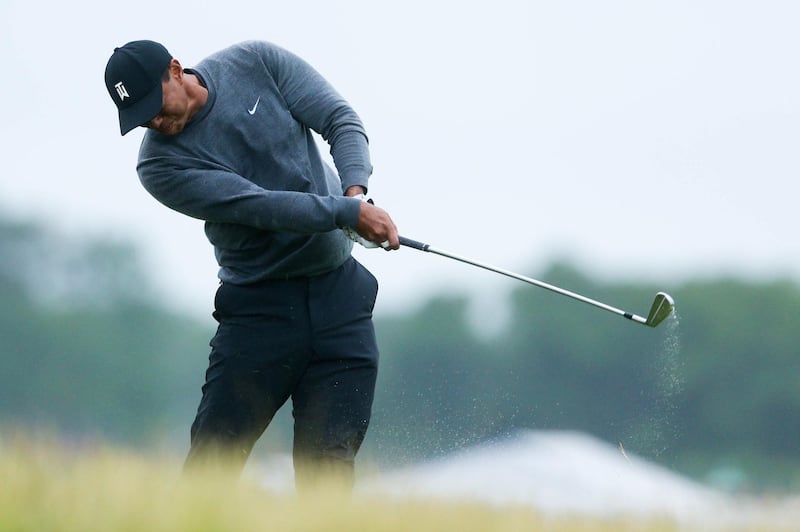 Jun 15, 2018; Southampton, NY, USA; Tiger Woods hits a shot from the rough on the eighteenth fairway during the second round of the U.S. Open golf tournament at Shinnecock Hills GC - Shinnecock Hills Golf C. Mandatory Credit: Brad Penner-USA TODAY Sports