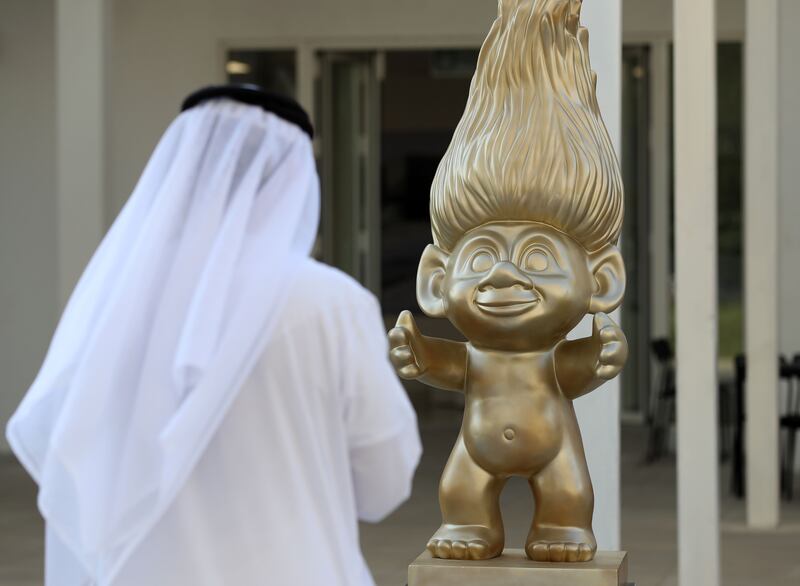 A visitor takes a picture of a troll outside the Danish pavilion on the 10th day of Expo 2020 Dubai. Chris Whiteoak / The National
