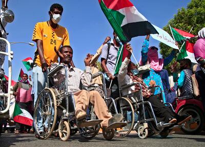 Sudanese demonstrators march in Khartoum on December 9, 2021, to protest against deal that reinstated Prime Minister Abdulla Hamdok after a military coup. AFP