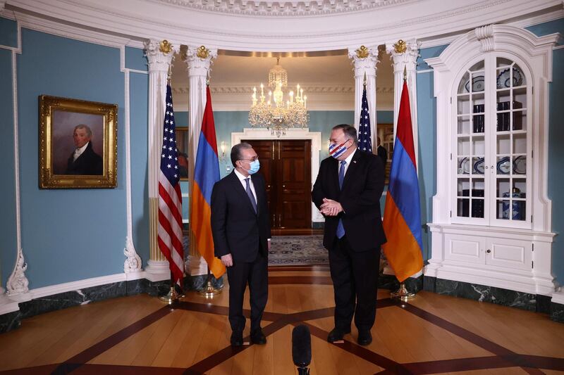Armenian Foreign Minister Zohrab Mnatsakanyan (L) meets with US Secretary of State Mike Pompeo to discuss the conflict in Nagorno-Karabakh, at the State Department in Washington, DC, on October 23, 2020.  / AFP / POOL / HANNAH MCKAY
