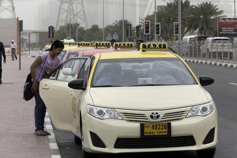 A woman takes a taxi from the RTA’s rank at Ibn Battuta. Jaime Puebla / The National