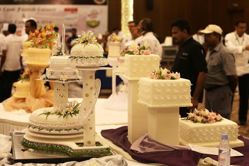 Cakes on display in the Three Tier Wedding Cake section in the East Coast Culinary Competition held at Miramar Al Aqah Beach Resort in Fujairah. Pawan Singh / The National 
