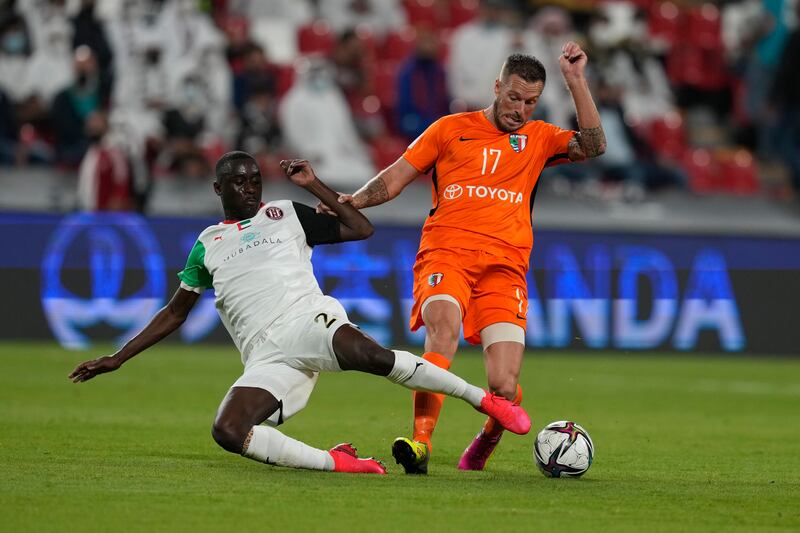 Al Jazira's Abdulla Idrees tackles Sylvian Graglia of Pirae. AP