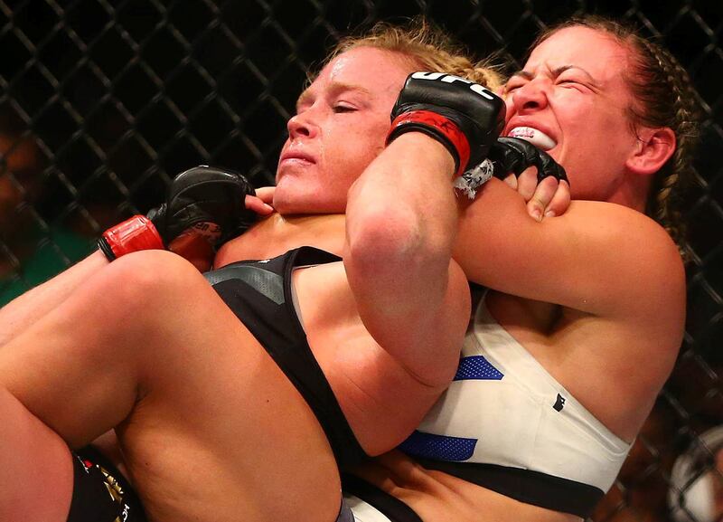 March 5, 2016; Las Vegas, NV, USA; Miesha Tate applies a chokehold to win by submission against Holly Holm during UFC 196 at MGM Grand Garden Arena. Mandatory Credit: Mark J. Rebilas-USA TODAY Sports  / Reuters 
Picture Supplied by Action Images *** Local Caption *** 2016-03-06T054150Z_1472716006_NOCID_RTRMADP_3_MMA-UFC-196-HOLM-VS-TATE.JPG