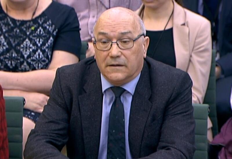 In this image taken from video, Mark Goldring, CEO of Oxfam GB, gives evidence before the Commons Development Committee at Portcullis House, London, Tuesday Feb. 20, 2018. British lawmakers are set to question officials of two anti-poverty charities Tuesday amid concern sex predators are targeting aid organizations because of the chaotic environments in which they work. (PA via AP)