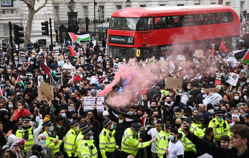 Supporters of Palestine attend a rally outside the UK prime minister's residence at 10 Downing Street, London, in protest at violence in Jerusalem and Israeli air strikes on the Gaza Strip. EPA