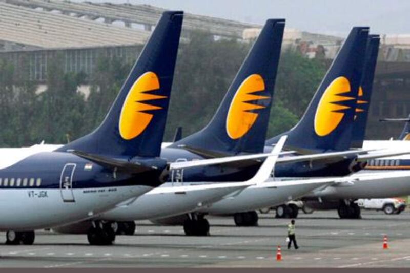 Jet Airways aircraft stand on tarmac at the domestic airport terminal in Mumbai September 9, 2009. India's Jet Airways cancelled more than 130 flights on Wednesday as a pilots' strike dragged into a second day, underlying uneasy labour relations that can hurt competitiveness. REUTERS/Punit Paranjpe (INDIA TRANSPORT CONFLICT BUSINESS) *** Local Caption ***  DEL09_INDIA-STRIKE-_0909_11.JPG