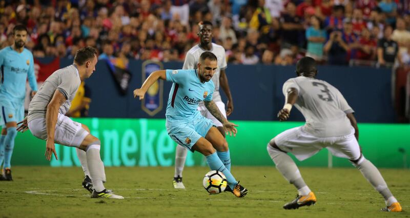 Manchester United's Eric Bailly and Phil Jones in action with Barcelona's Paco Alcacer. Carlos Barria / Reuters