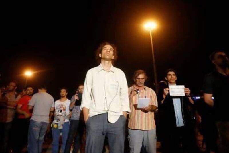 Erdem Gunduz ((centre) staged an eight-hour silent vigil in Istanbul's Taksim Square on Monday. Hundreds have followed.
