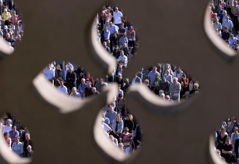 In this picture taken through the Cathedral of Mary's balcony, pilgrims celebrate a mass in Erfurt, Germany.  AP