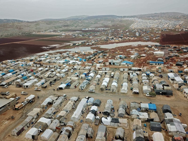A drone picture taken on December 15, 2020 shows a camp for displaced Syrians near the town of Kafr Lusin by the border with Turkey. AFP