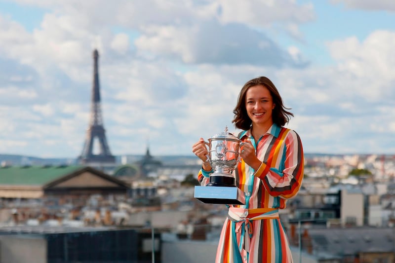 Poland's Iga Swiatek poses with the trophy Suzanne Lenglen. AFP