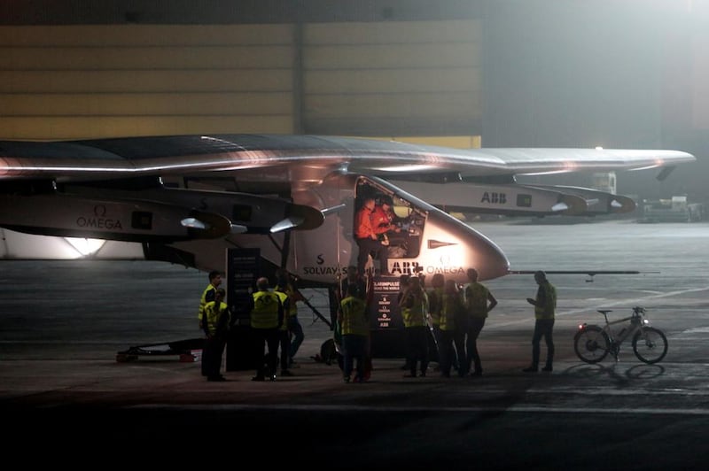 Solar Impulse crew members prepare for take-off at Al Bateen Executive Airport in Abu Dhabi. Christopher Pike / The National