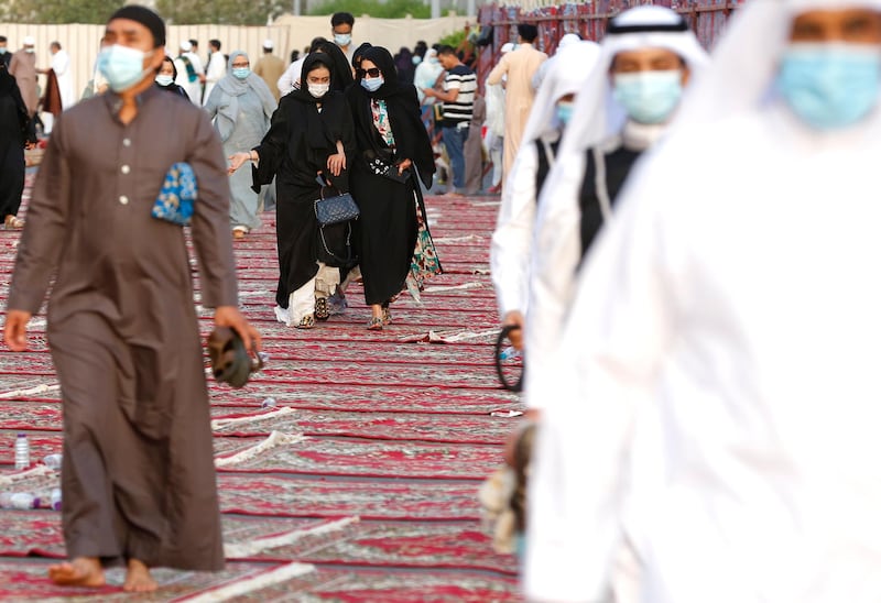 Mask-wearing worshippers after Eid Al Fitr prayers at Al Mirabi Mosque in Jeddah, Saudi Arabia. AP Photo