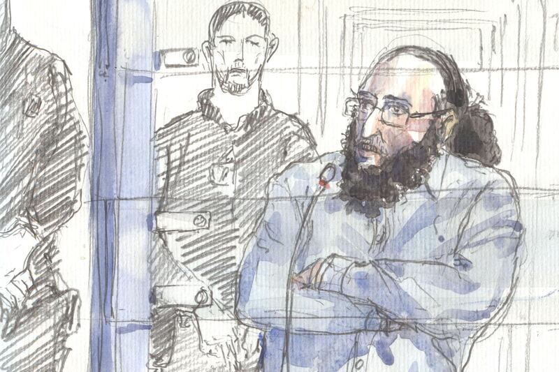 A court sketch made on October 20, 2017 at the Paris courthouse, shows Abdelkader Merah talking to the court during his trial for complicity in the series of shootings committed by his brother Mohamed in Toulouse and Montauban in 2012.
Violence, crime, anti-Semitism and seething resentment of France: the toxic family life that shaped the notorious French jihadist Mohamed Merah has been vividly exposed in court this week. / AFP PHOTO / Benoit PEYRUCQ / ALTERNATIVE CROP 