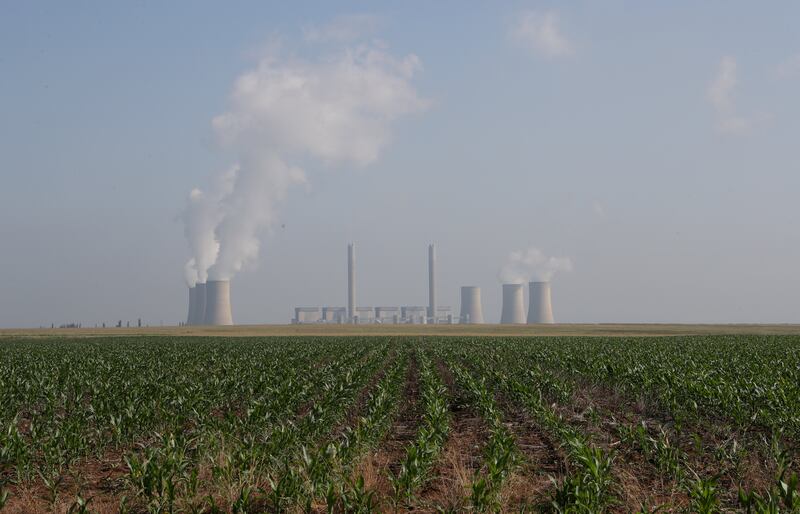 Lethabo Power Station, a coal-fired power station owned by state power utility Eskom, is seen near a maize field near Sasolburg, South Africa. Ahead of the next round of climate talks in Scotland in November, countries the world over are committing to reach net-zero greenhouse gas emissions by the middle of this century in an attempt to stop catastrophic climate change. REUTERS