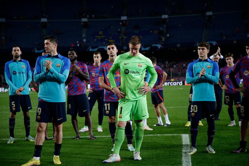 Barcelona players stand in dejection after the 3-0 Champions League defeat and elimination against Bayern Munich at Camp Nou on October 26, 2022. AP