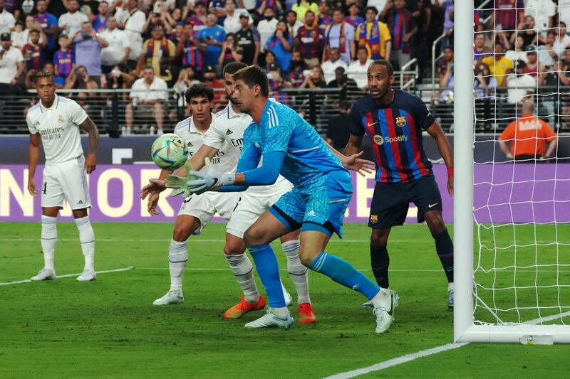 Thibaut Courtois makes a save during the pre-season game between Barcelona and Real Madrid. EPA