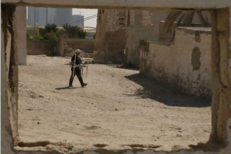 Matt Brewer, a research scholar from the UK's University of Southampton, maps the underground for possible materials or objects, at the Al Khan archaeological site in Sharjah.