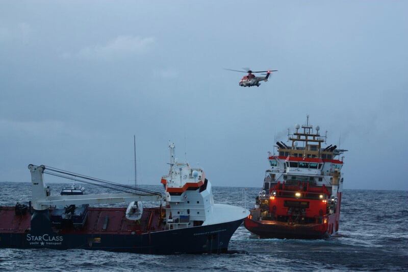 Normand Drott tug boat begins to gently turn the Dutch cargo ship Eemslift Hendrik, which was adrift in the Noorwegian Sea. EPA