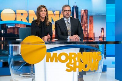 This image released by Apple TV Plus shows Jennifer Aniston, left, and Steve Carell in a scene from "The Morning Show," debuting Nov. 1, as part of the first wave of series that will launch the Apple TV Plus streaming service. (Hilary B. Gayle/Apple TV Plus via AP)