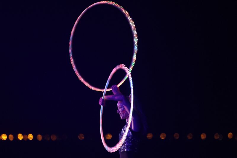 A woman plays with a hula hoop during a party in the Saudi Red Sea resort.