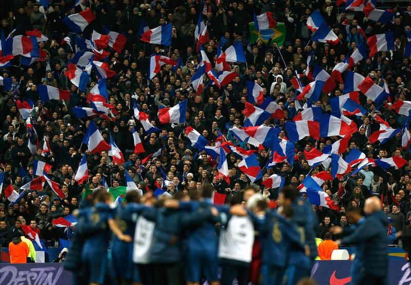 French fans celebrate after their side won the FIFA 2014 World Cup Qualifier 2nd leg playoff between France and Ukraine at the Stade de France on November 19, 2013 in Paris. France has sold 34,971 tickets for the finals in Brazil so far, 2.3 per cent of the total. Harry Engels / Getty Images