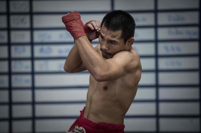 World Boxing Council (WBC) mini-flyweight champion, Wanheng Menayothin, warming up during a training session in Bangkok. Lillian Suwanrumpha / AFP