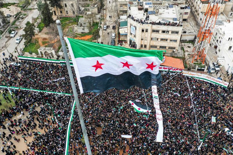A rally to mark the 12th anniversary of the start of the uprising against Syrian President Bashar Al Assad and his government, in the rebel-held north-western city of Idlib. AFP

