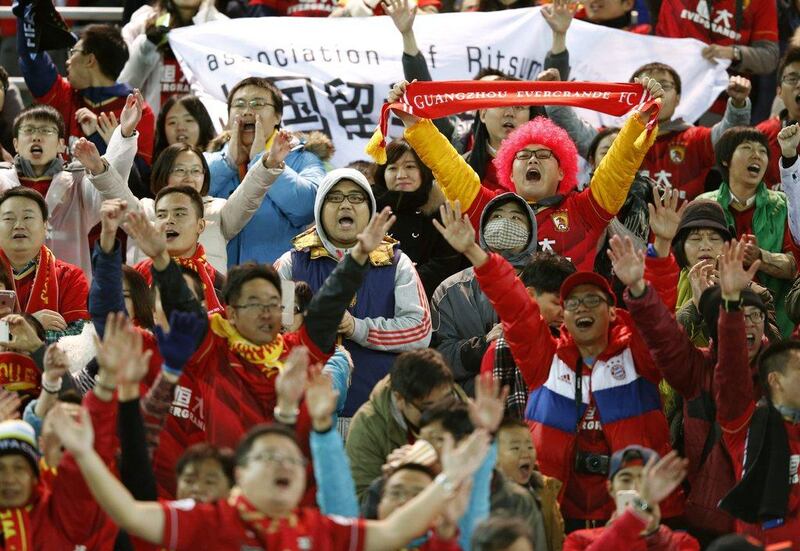 Guangzhou Evergrande fans cheer for their team. Toru Hanai / Reuters