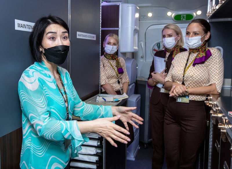 Yanjuan Sun, left, cabin manager and hospitality trainer at Etihad Airways. The airline is recruiting more cabin crew as it plans to return four of its 10 A380 superjumbos to the fleet this summer. Victor Besa / The National