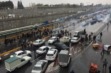 People stop their cars on a road in Tehran, Iran, on November 16, 2019 in protest against fuel price rises . Wana