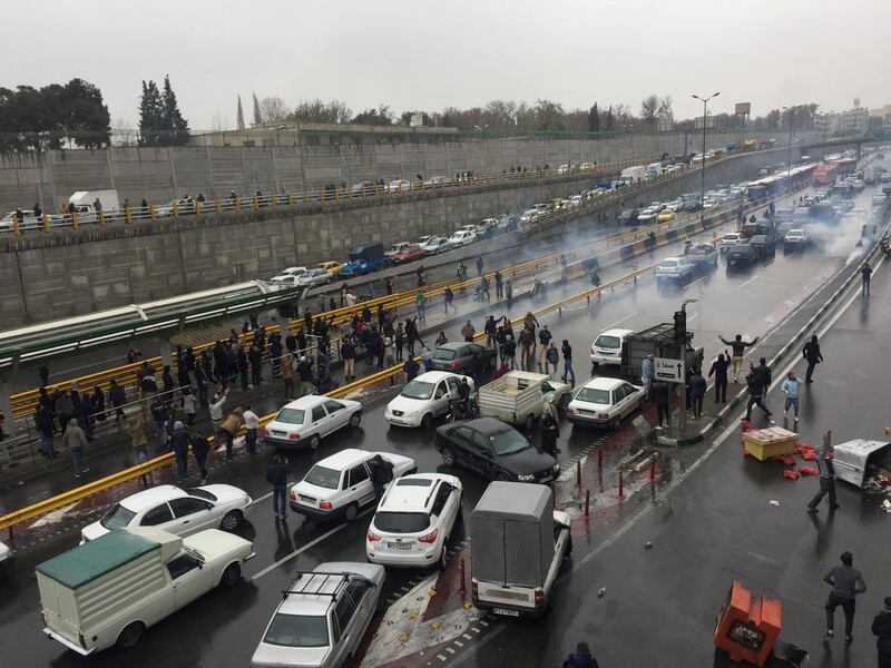 FILE PHOTO: People stop their cars in a highway to show their protest for increased gas price in Tehran, Iran November 16, 2019. Nazanin Tabatabaee/WANA (West Asia News Agency) via REUTERS ATTENTION EDITORS - THIS IMAGE HAS BEEN SUPPLIED BY A THIRD PARTY/File Photo