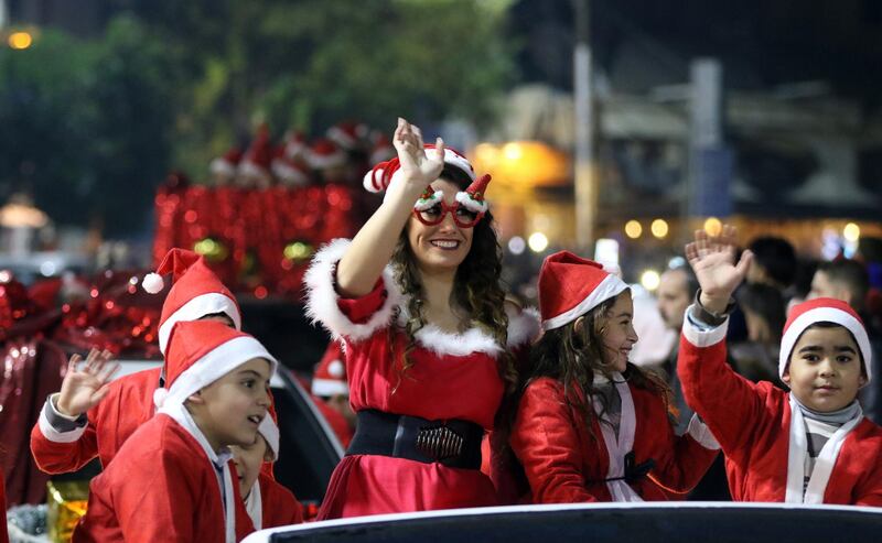 Syrians dressed in Santa Claus costumes take part in street celebrations held in the mostly Christian-populated Bab Touma neighborhood in the Olld City of Damascus, Syria.  EPA
