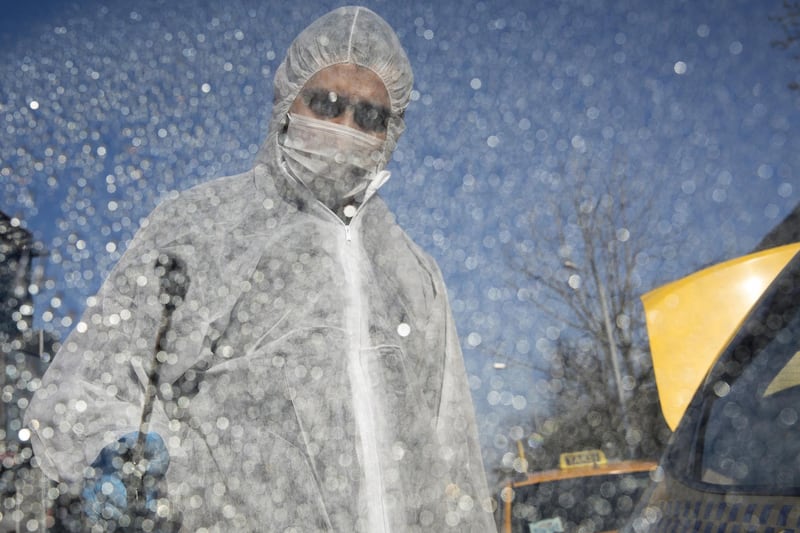 A metropolitan municipality worker wearing a hazmat suit sprays disinfectant onto a taxi window in Istanbul, Turkey, on Saturday, March 14, 2020. Turkey confirmed three more coronavirus cases, taking its total to five. The country also announced it was suspending flights to several European countries to attempt to curb the outbreak. Photographer: Kerem Uzel/Bloomberg