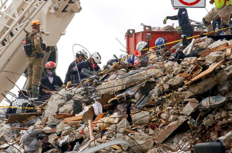 Emergency workers conduct search and rescue efforts. Reuters