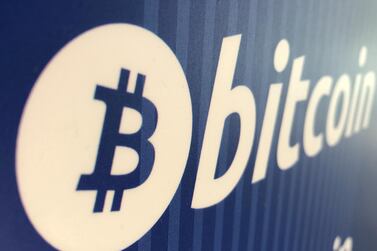 A Bitcoin logo on a cryptocurrency ATM in Santa Monica, California. Digital currency has fallen 15 per cent since Friday. Reuters