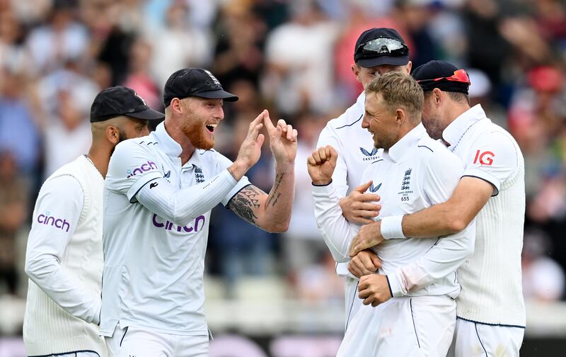 Joe Root of England celebrates with Ben Stokes after catching Alex Carey of Australia off his own bowling. Getty