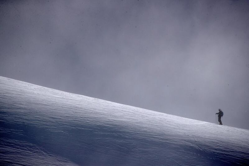 A skier stands on a ridge during the Winter Games NZ at the Remarkables ski resort near Wanaka in New Zealand. Reuters