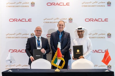 Mohamed Al Kuwaiti, right, managing director of the UAE's National Data Centre, and Nick Redshaw, left, senior vice president of cloud technology and UAE country leader at Oracle, during the signing ceremony for an agreement to boost cyber security co-operation. Photo: Oracle