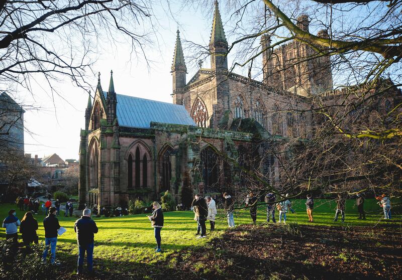 People queue to receive vaccine and booster doses at Chester Cathedral. Reuters