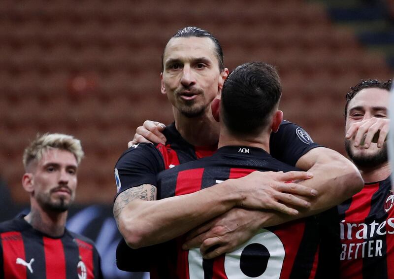 Milan's Zlatan Ibrahimovic celebrates scoring their second goal with teammates. Reuters