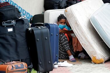 Ethiopian domestic workers who were dismissed by their employers gather with their belongings outside their country’s embassy in Hazmiyeh, east of Beirut, on June 24, 2020. AFP