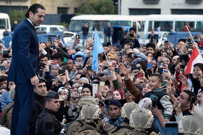 Mr Hariri greets his father's supporters. EPA 
